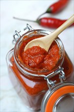 Red Thai curry paste in glass
