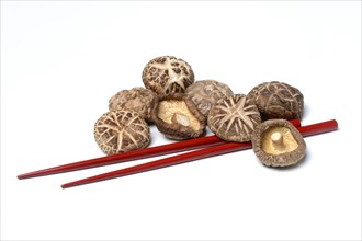 Dried shiitake mushrooms and chopsticks