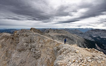 Hiker at the summit of the Western Oedkarspitze