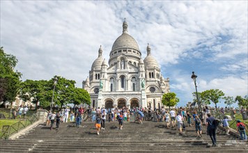 Tourists on the steps in front of the Sacre-Coeur Basilica