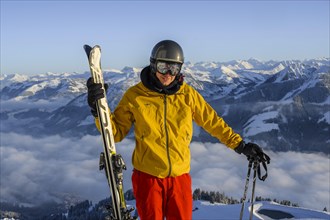 Skier in front of mountain panorama