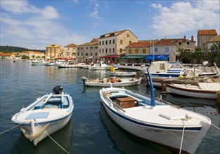 Promenade with fishing boats in the port