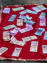 Counterfeit money is offered for sale on the street
