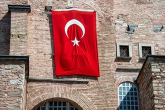 Turkish flag on the brick wall of the Hagia Sophie