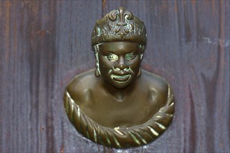 Male bronze figure as doorknob