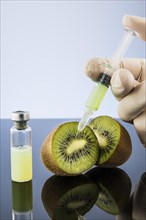 Liquid is injected into a kiwi