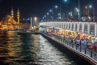 The new mosque and the Galata Bridge in Eminoenue district at night