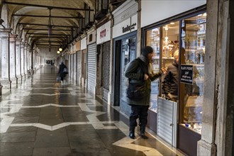 St. Mark's Square shops are protected from water during Acqua alta