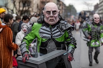 Person masked as a mythical creature at the carnival parade of the Maettli Guild in Littau