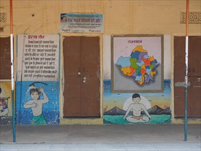 Facade of a school with teaching material on the wall