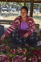Market woman with pork