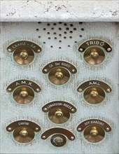 Brass doorbells on a residential building