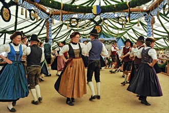 Dancers of a Bavarian folk dance group in traditional traditional traditional traditional traditional traditional traditional traditional traditional traditional costume
