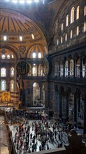 Crowds of people inside the Hagia Sophia