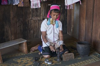Padaung ethnic group woman making bracelets near Pan Pet village