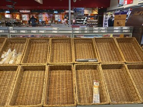 Empty shelves for bread in the supermarket