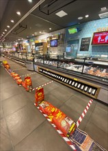 Barriers in supermarket for social distancing at fish counter