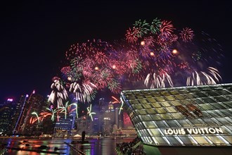 Fireworks over the Marina Bay Sands Reservoir with Louis Vuitton Shopping Mall