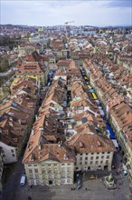 View from the Bernese Minster to the Muensterplatz and the red tiled roofs of the houses in the historic centre of the old town