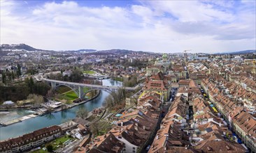 View from Bern Cathedral to the red tiled roofs of the houses in the historic city centre of the old town and river Aare
