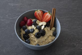 Porridge or porridge in bowl with fruits