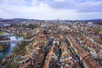 View from Bern Cathedral to the red tiled roofs of the houses in the historic city centre of the old town and river Aare