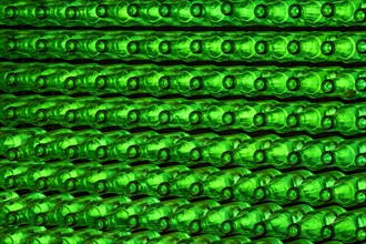 Empty green beer bottles on the conveyor belt