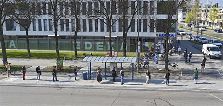 Queue in front of supermarket