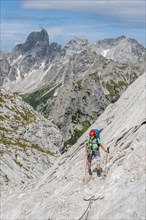 Mountaineer on marked route from Simonyhuette to Adamekhuette