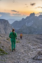Two hikers in rocky alpine terrain