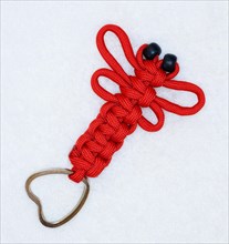 Crafted key ring made of red Paracord