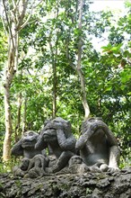 Three monkey figures
