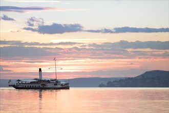 The old steamboat Hohentwiel on a sunset cruise