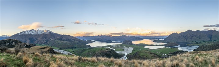 Sunset, panorama view on Wanaka Lake and mountains