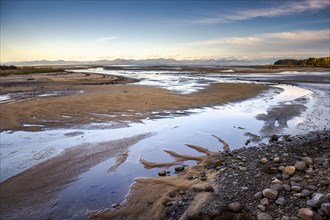 Evening mood at low tide, sand formations on the coast of Torrent Bay