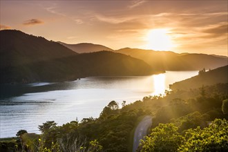 Evening mood over coastal inlet, bay with hilly landscape of the Marlborough Sounds