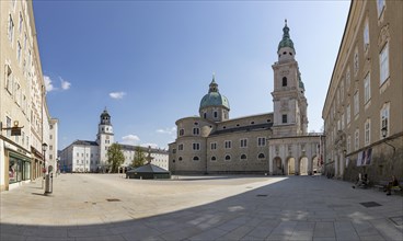 Empty squares due to the coronavirus pandemic, Residenzplatz with Salzburg Cathedral and Salzburg Carillon