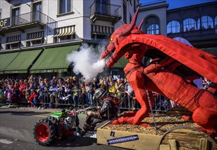 Smoking dragon figure on a float, Carnival parade of the Wey Guild on Rose Monday