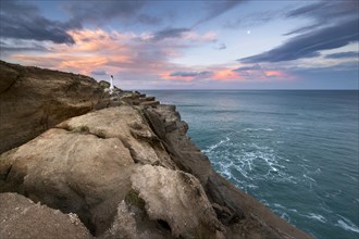 Lighthouse on the cliffs at Castlepoint, in the back turquoise ocean