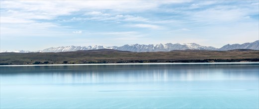 Blue glacier lake Lake Pukaki with mountain range, Mount Cook National Park