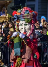 Masked person, knitting woman