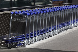Long row of baggage trolleys at Duesseldorf airport, airport trolley