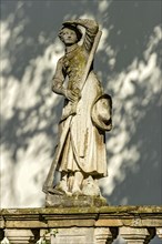 Sculpture of a farmer's wife with hoe at the little castle, original hunting lodge