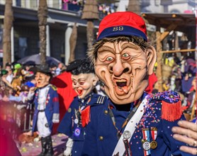Disguised person with badge, Carnival procession of the Wey Guild on Rosenmontag
