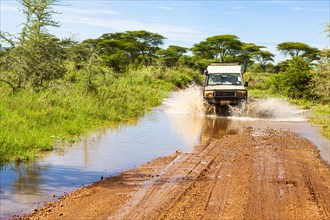 Jeep crosses a ford with water, Serengeti National Park