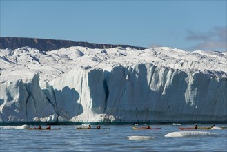 Tourists in kayaks in front of glaciers, Croker Bay