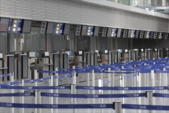 Check in counter in the deserted departure hall, Duesseldorf Airport during the Corona Pandemic