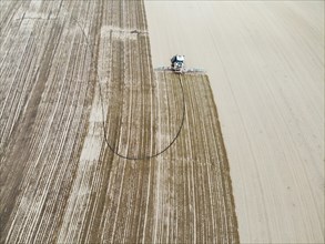 Farmer spreading liquid manure in a field, Otelfingen ZH