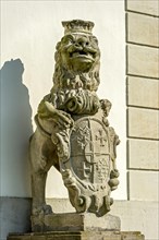 Sculpture of a lion with shield of the prince abbot Adolf von Dalberg at the banquet hall, court of honour