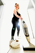 Woman vacuum cleaning